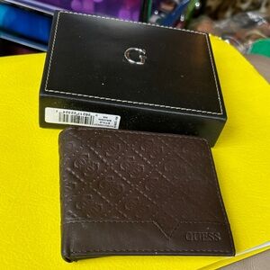 GUESS Brown Embossed Faux Leather Bi-fold Wallet.